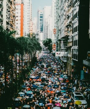 people in a city street during daytime